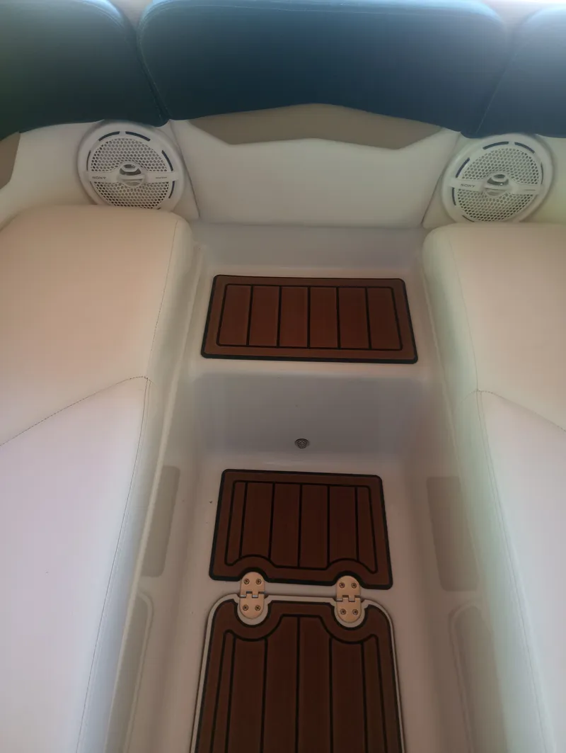 Slide: The Image of Interior of a 2013 Four Winns H260 boat with speakers. - 29
