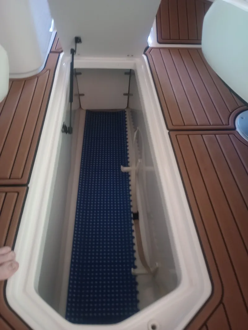Slide: The Image of Storage compartment in 2013 Four Winns H260 boat. - 30