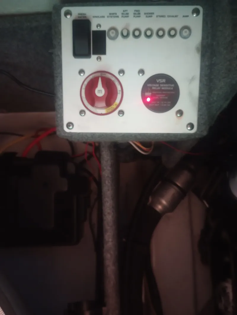 Slide: The Image of Electrical control panel of a 2013 Four Winns H260 boat. - 31