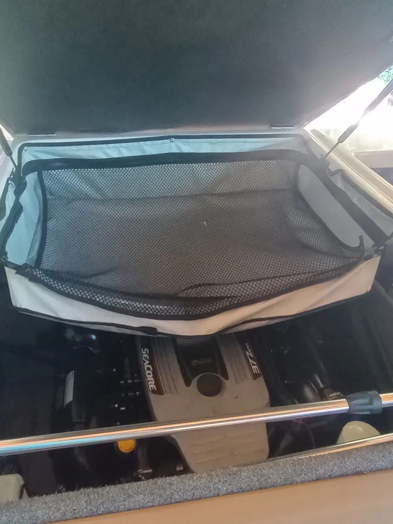 Slide: The Image of Engine compartment of 2013 Four Winns H260 boat. - 33