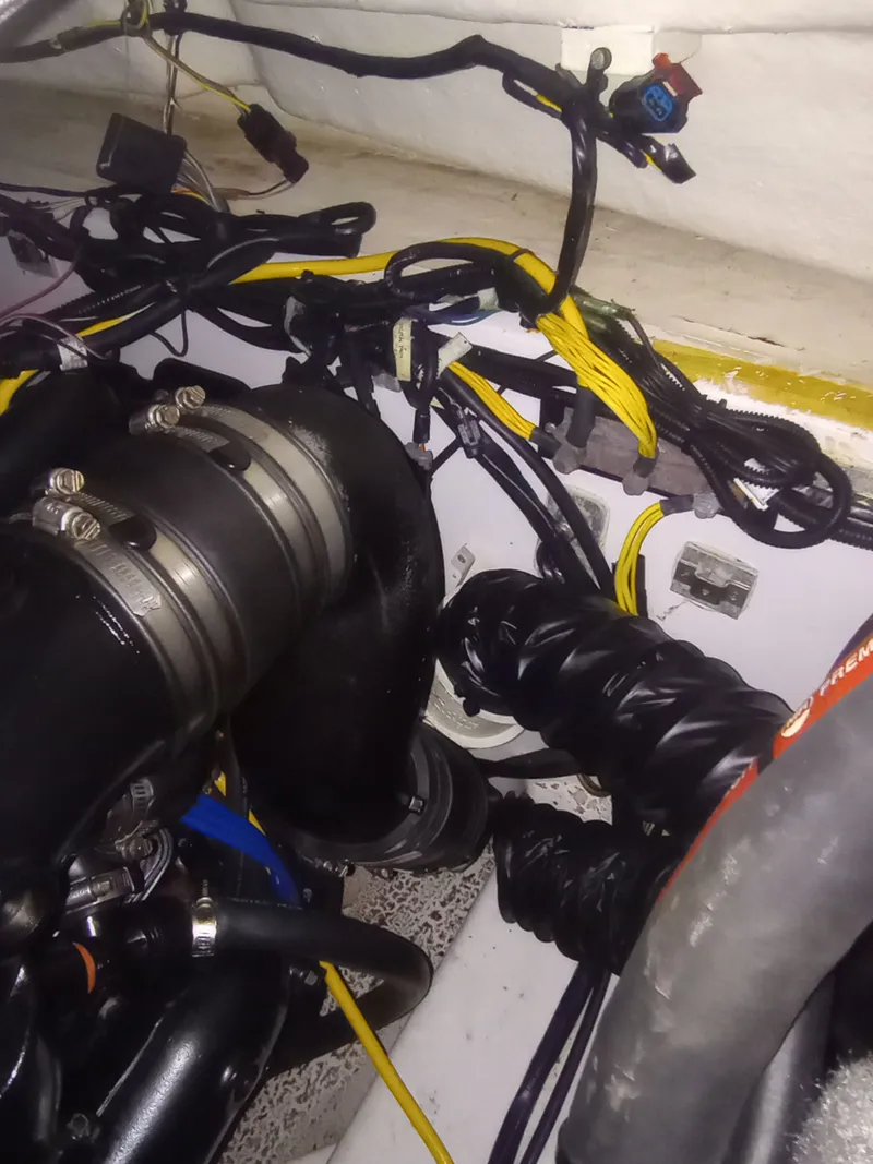 Slide: The Image of Engine compartment of a 2013 Four Winns H260 boat. - 35