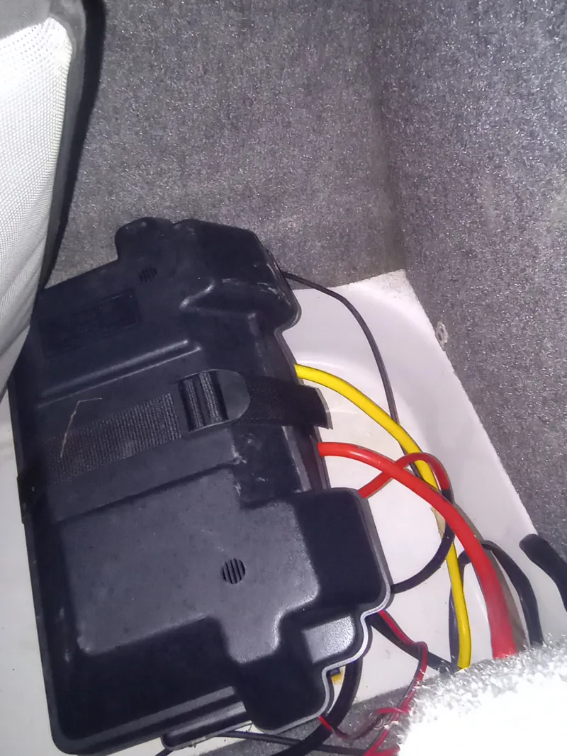 Slide: The Image of Battery cover and cables in Four Winns H260 boat, year 2013. - 36
