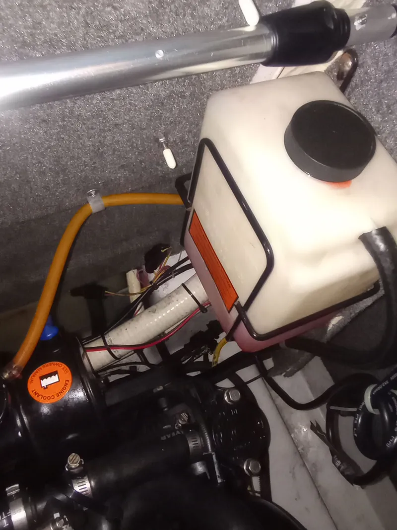 Slide: The Image of Engine compartment of a 2013 Four Winns H260 boat. - 37