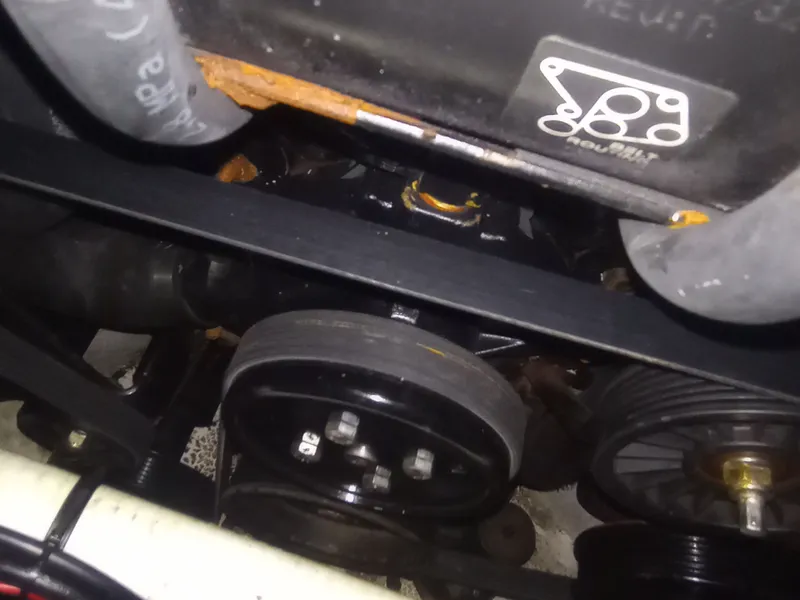 Slide: The Image of Engine compartment of a 2013 Four Winns H260 boat. - 38