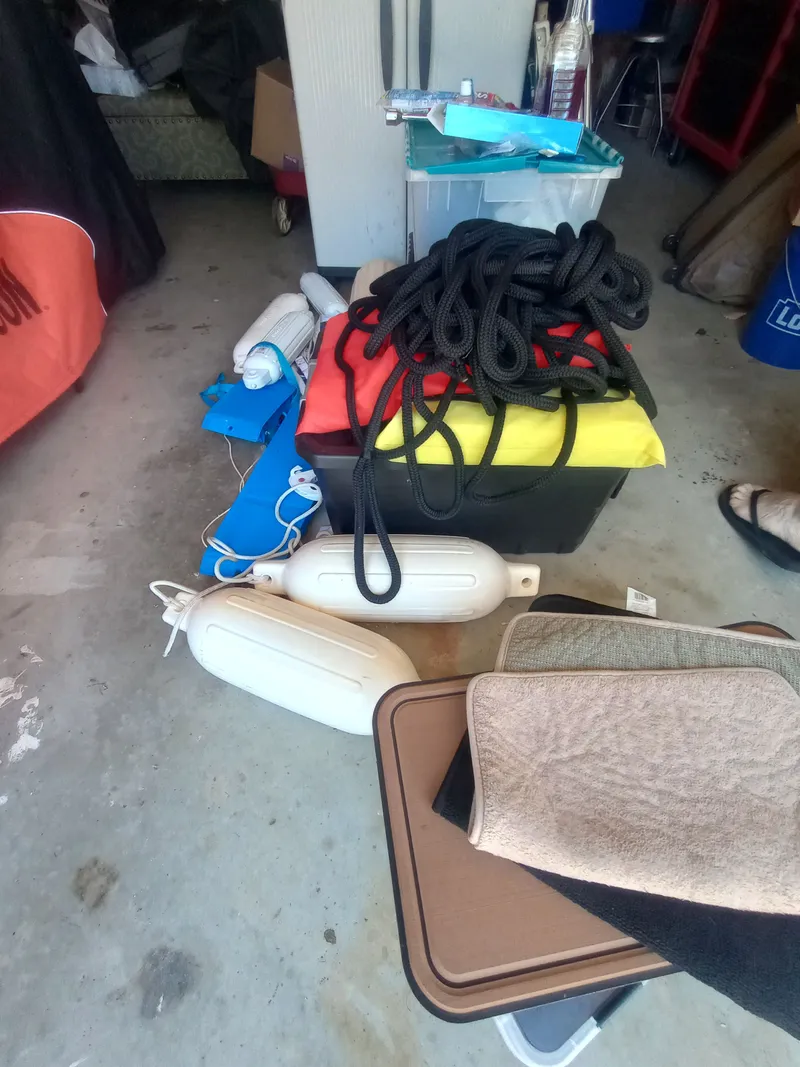 Slide: The Image of Boat accessories in storage, ropes and fenders, Four Winns H260 2013. - 40