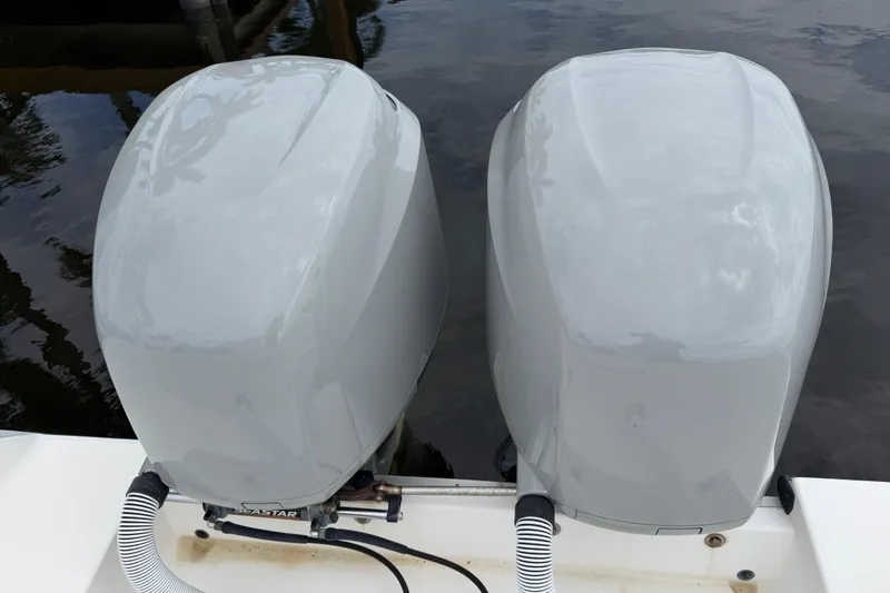 Slide: The Image of Twin outboard motors on a 2002 Regulator 32 Forward Seating boat. - 10