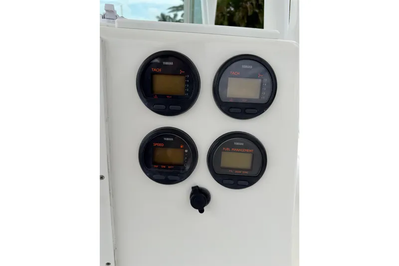 Slide: The Image of Yamaha gauges on 2002 Regulator 32 Forward Seating boat dashboard. - 18