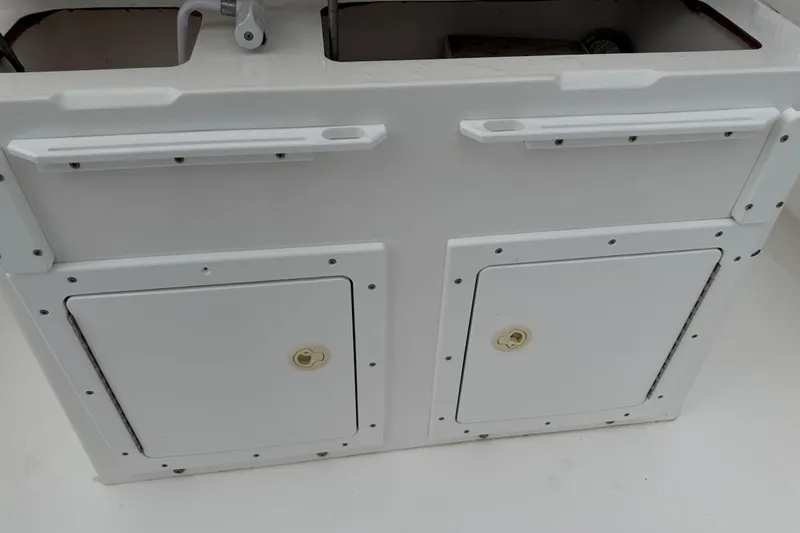Slide: The Image of Storage compartments on a 2002 Regulator 32 Forward Seating boat. - 21
