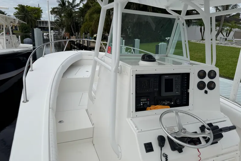 Slide: The Image of 2002 Regulator 32 Forward Seating boat with helm controls and navigation equipment. - 22