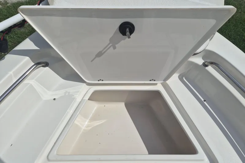 Slide: The Image of Open storage compartment on a 2022 Key West 189 FS boat, showcasing interior space. - 14