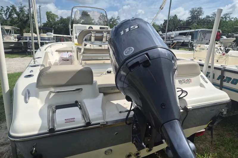 Slide: The Image of 2022 Key West 189 FS boat with 115 HP engine, parked outdoors. - 3
