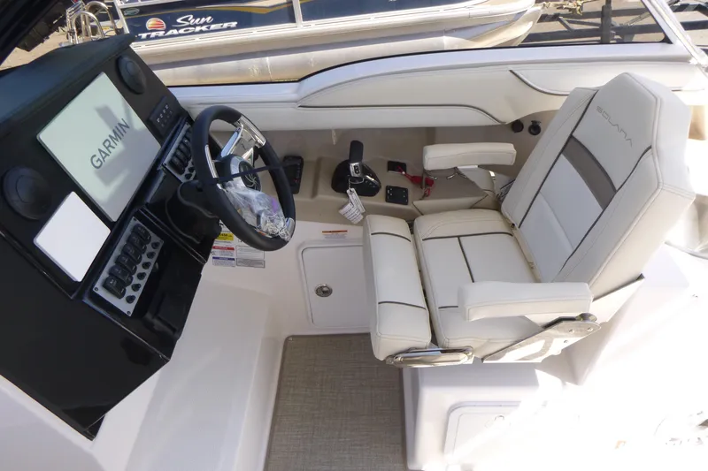 Slide: The Image of Cockpit of 2026 Solara S-250 DC boat with Garmin navigation system and plush seating. - 14