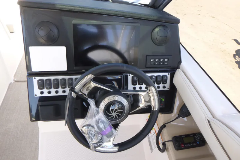 Slide: The Image of Dashboard of 2026 Solara S-250 DC boat with steering wheel and control panel. - 15