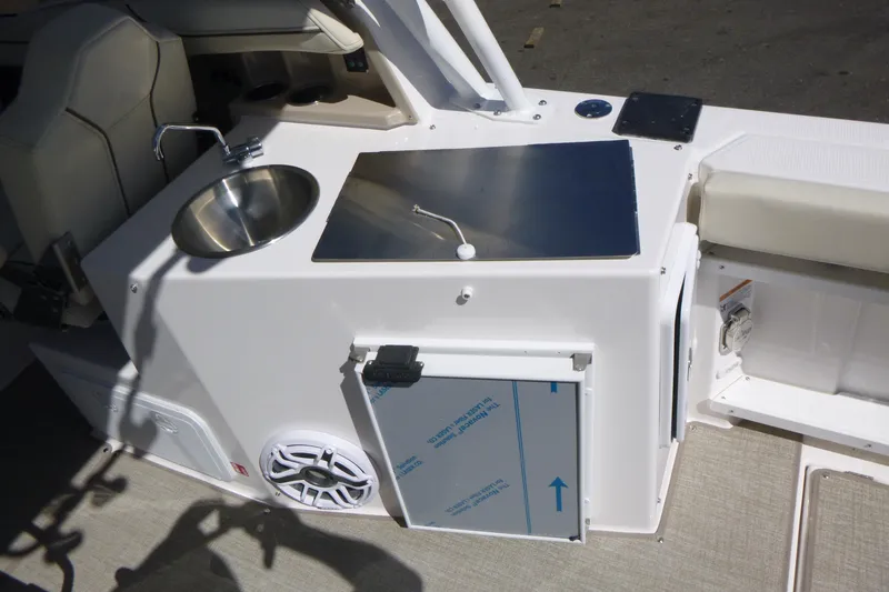 Slide: The Image of 2026 Solara S-250 DC boat interior with sink, countertop, and seating area. - 22