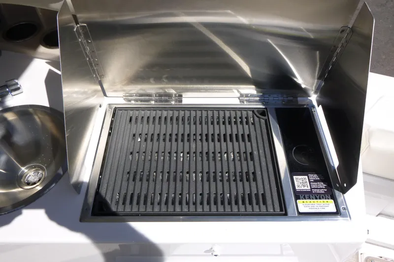 Slide: The Image of Outdoor grill on Solara S-250 DC boat, 2026 model, with stainless steel finish. - 24
