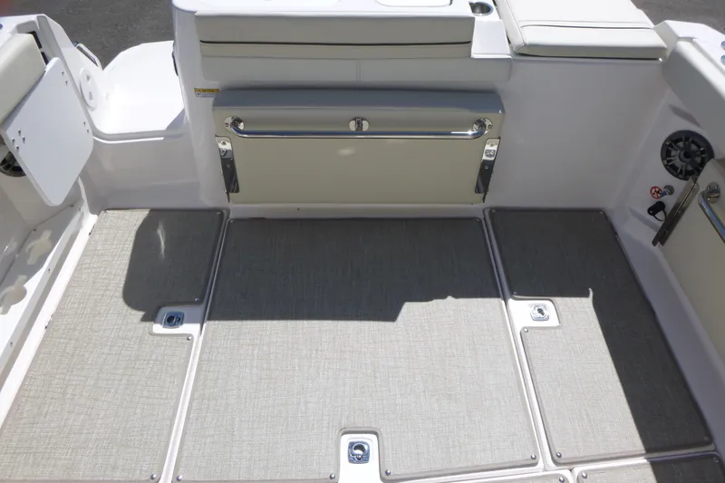 Slide: The Image of 2026 Solara S-250 DC boat interior with cushioned seating and storage compartments. - 31