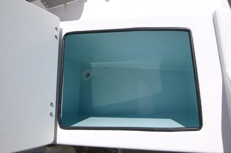 Slide: The Image of Open storage compartment on 2026 Solara S-250 DC boat. - 34
