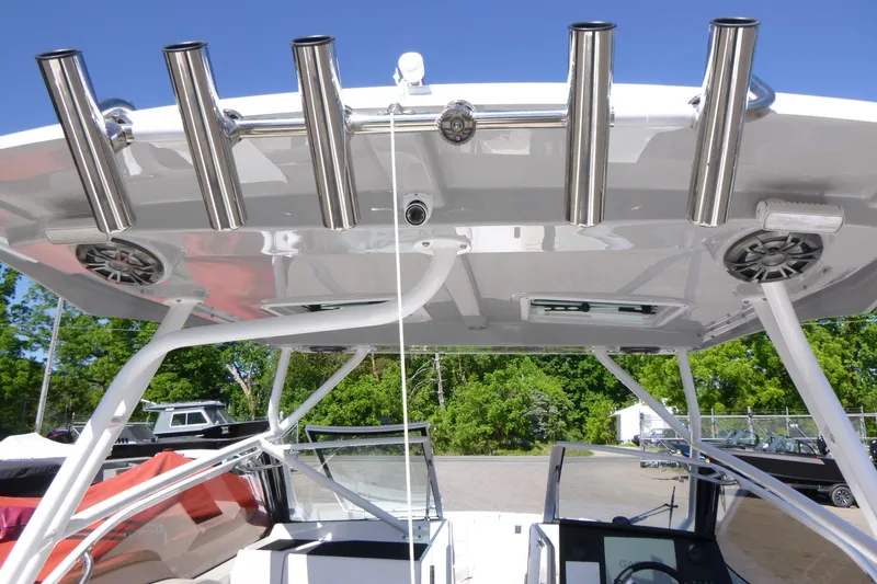 Slide: The Image of 2026 Solara S-250 DC boat with stainless steel rod holders and speakers on the canopy. - 37