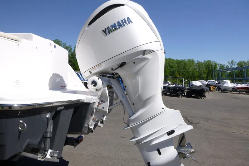 Slide: The Image of 2026 Solara S-250 DC boat with Yamaha outboard motor in a marina setting. - 39