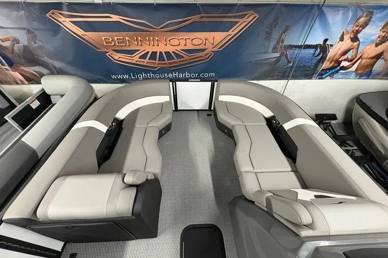 Slide: The Image of Luxurious Evotti 523QL boat interior with plush seating, showcased at Bennington display. - 1