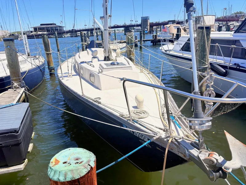 Slide: The Image of 1972 Tartan 34 Classic sailboat docked in harbor. - 1