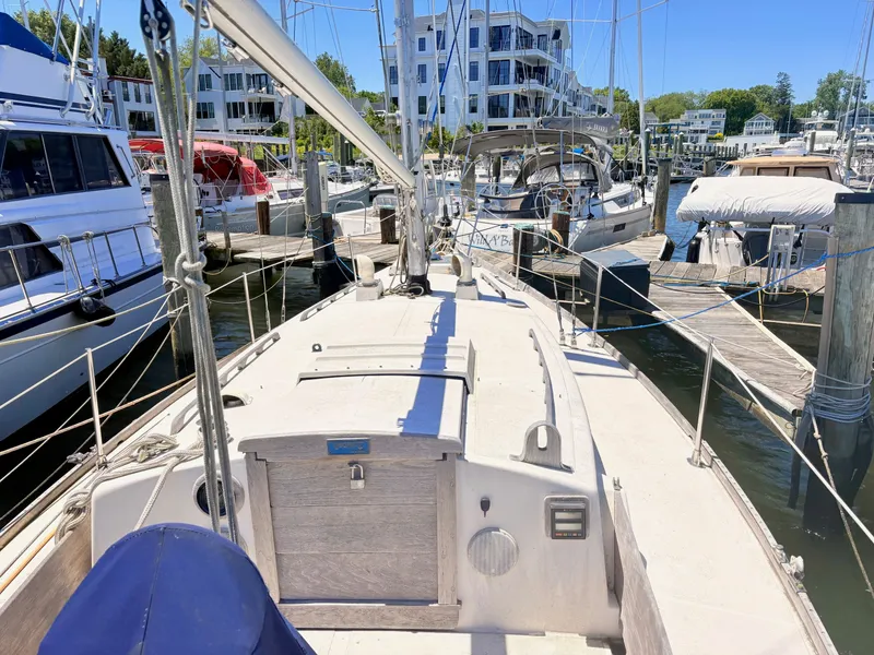 Slide: The Image of 1972 Tartan 34 Classic sailboat docked at marina. - 10