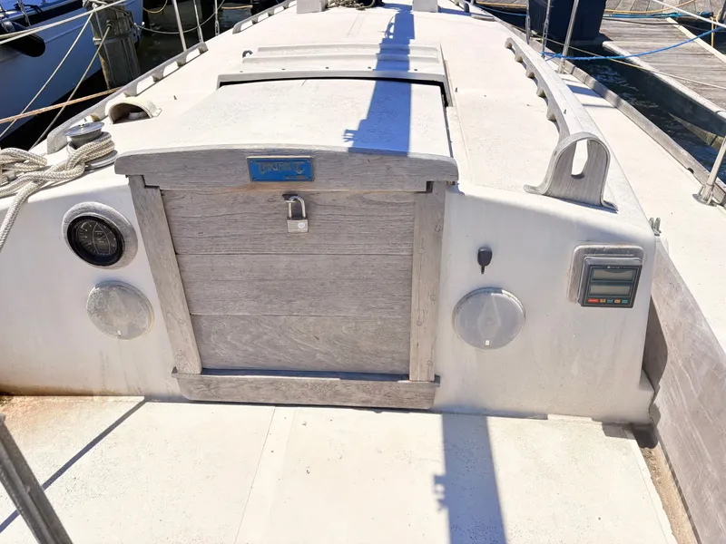 Slide: The Image of 1972 Tartan 34 Classic Yacht with wooden details in harbor. - 13