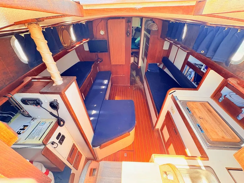 Slide: The Image of Interior of a 1972 Tartan 34 Classic yacht with wooden furnishings. - 14