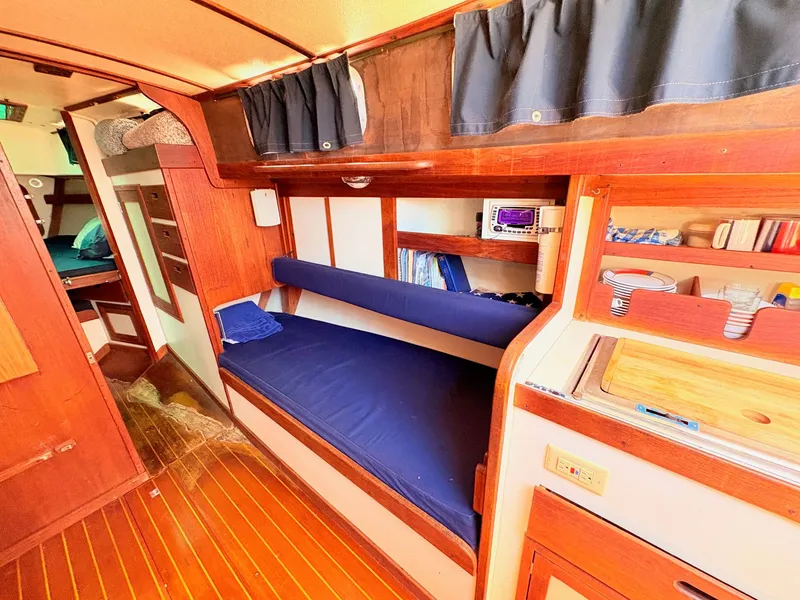 Slide: The Image of Interior of a 1972 Tartan 34 Classic yacht with wooden furnishings. - 16