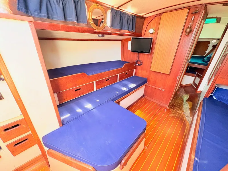 Slide: The Image of Interior of a 1972 Tartan 34 Classic yacht with wooden furnishings. - 18