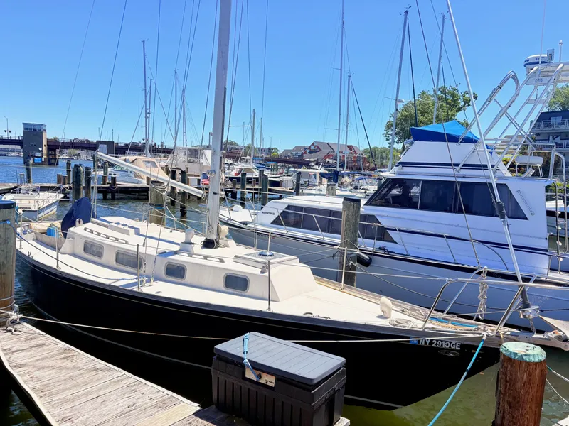 Slide: The Image of 1972 Tartan 34 Classic sailboat docked in marina. - 2