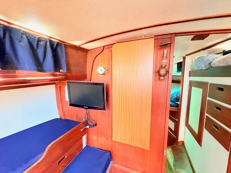 Slide: The Image of Interior of a 1972 Tartan 34 Classic yacht with wood paneling. - 21