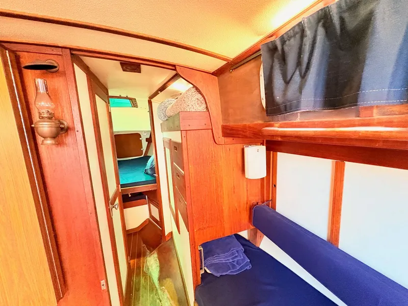 Slide: The Image of Interior of a 1972 Tartan 34 Classic yacht with wooden furnishings. - 22