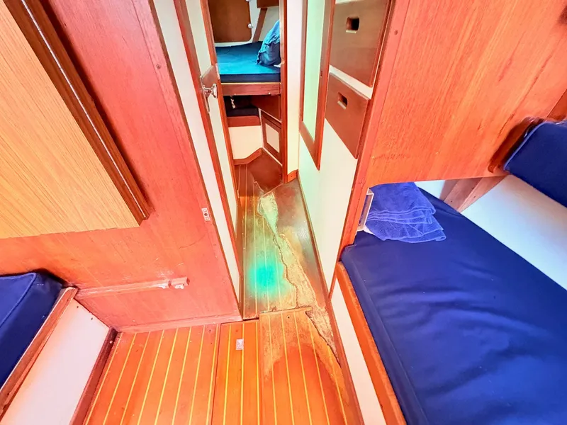 Slide: The Image of Interior of a 1972 Tartan 34 Classic yacht with wooden flooring. - 23