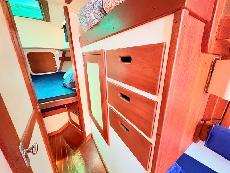 Slide: The Image of Interior of a 1972 Tartan 34 Classic yacht with wooden furnishings. - 24