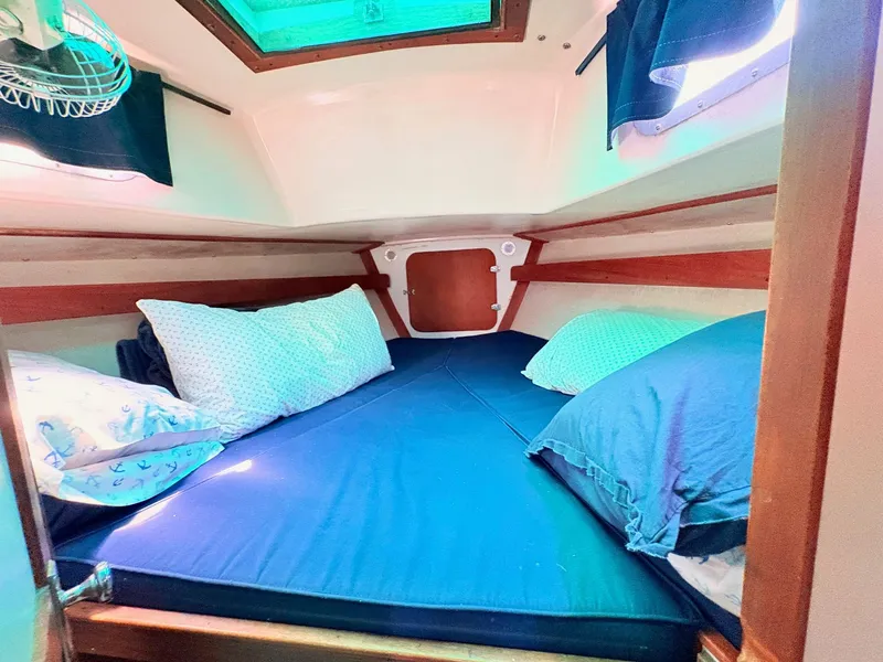 Slide: The Image of Interior of a 1972 Tartan 34 Classic yacht with cozy bed. - 26