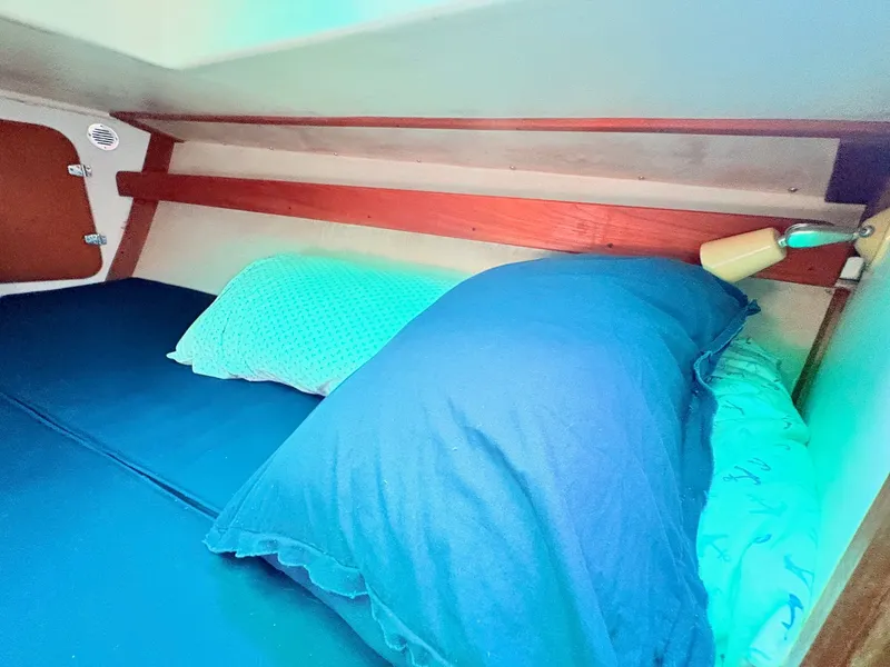 Slide: The Image of Interior of a 1972 Tartan 34 Classic yacht with cozy bed. - 27