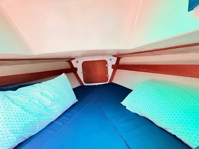 Slide: The Image of Interior of a 1972 Tartan 34 Classic yacht with cozy bedding. - 28