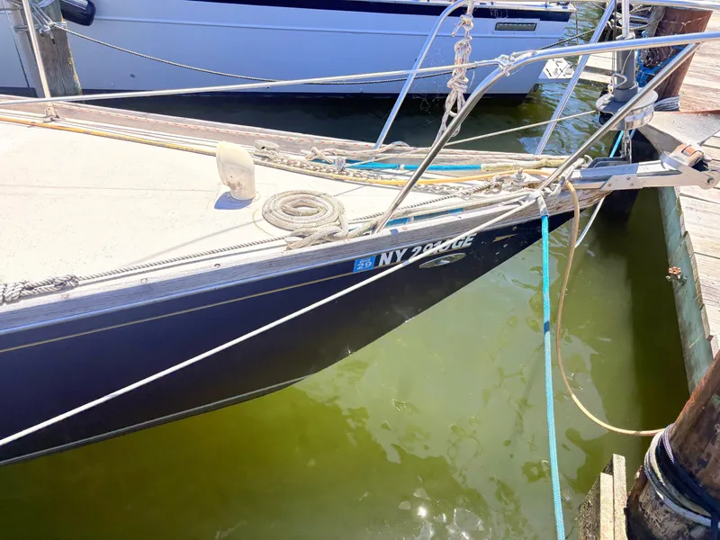 Slide: The Image of 1972 Tartan 34 Classic sailboat moored at dock. - 3
