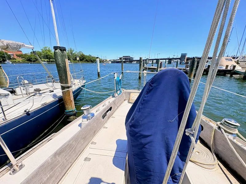Slide: The Image of 1972 Tartan 34 Classic sailboat docked in marina. - 33
