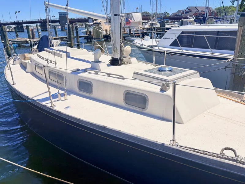Slide: The Image of 1972 Tartan 34 Classic sailboat docked in harbor. - 4