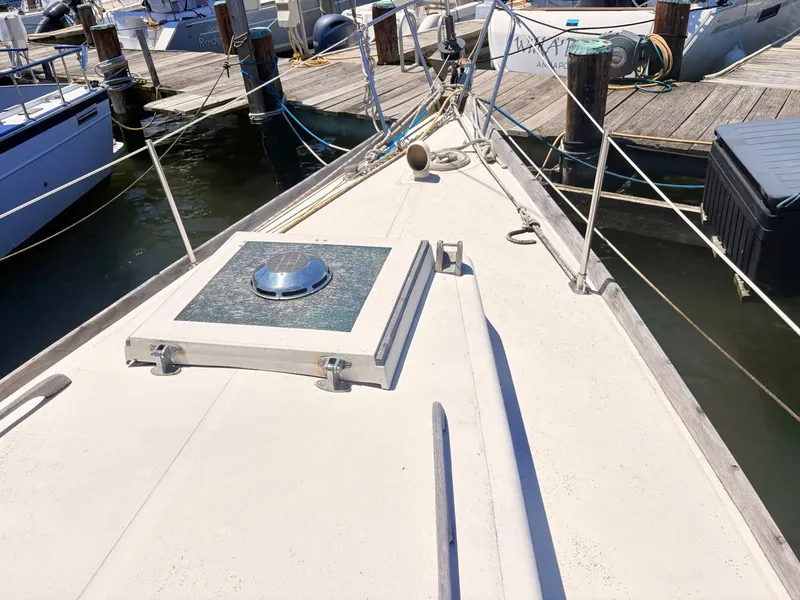 Slide: The Image of Deck of a 1972 Tartan 34 Classic sailboat in harbor. - 5