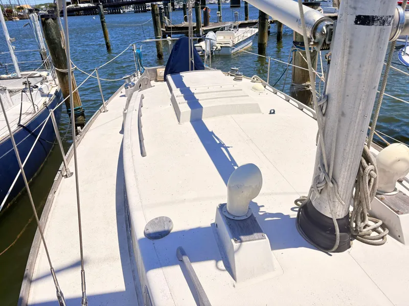 Slide: The Image of 1972 Tartan 34 Classic sailboat docked at marina. - 6