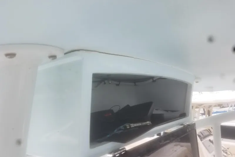 Slide: The Image of 2020 Hells Bay Ester boat interior storage compartment with visible equipment. - 5