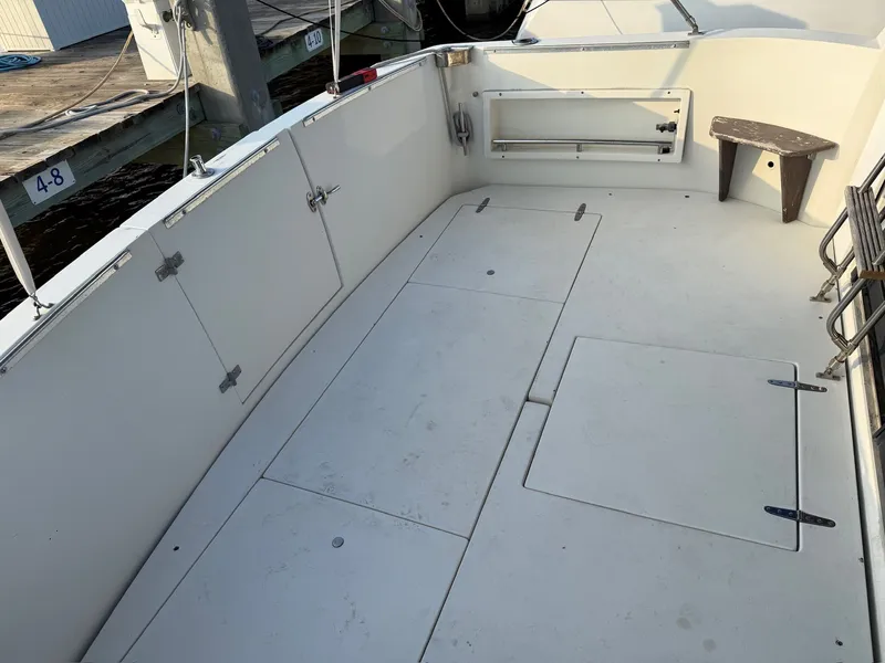 Slide: The Image of Deck of 1989 Carver 320 Voyager with storage and bench. - 1