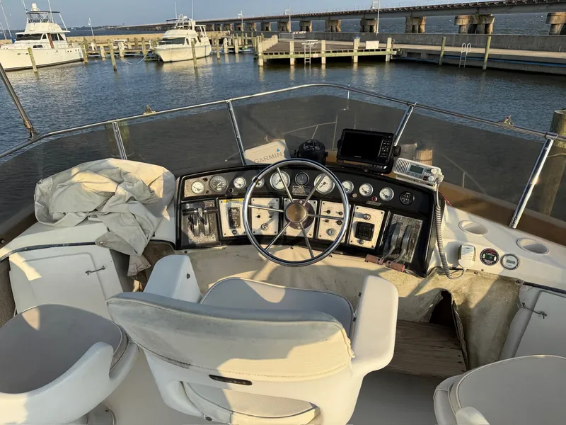 Slide: The Image of Cockpit of a 1989 Carver 320 Voyager boat in harbor. - 11