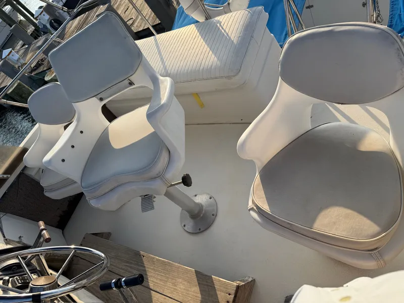 Slide: The Image of Interior of a 1989 Carver 320 Voyager with white seating. - 12