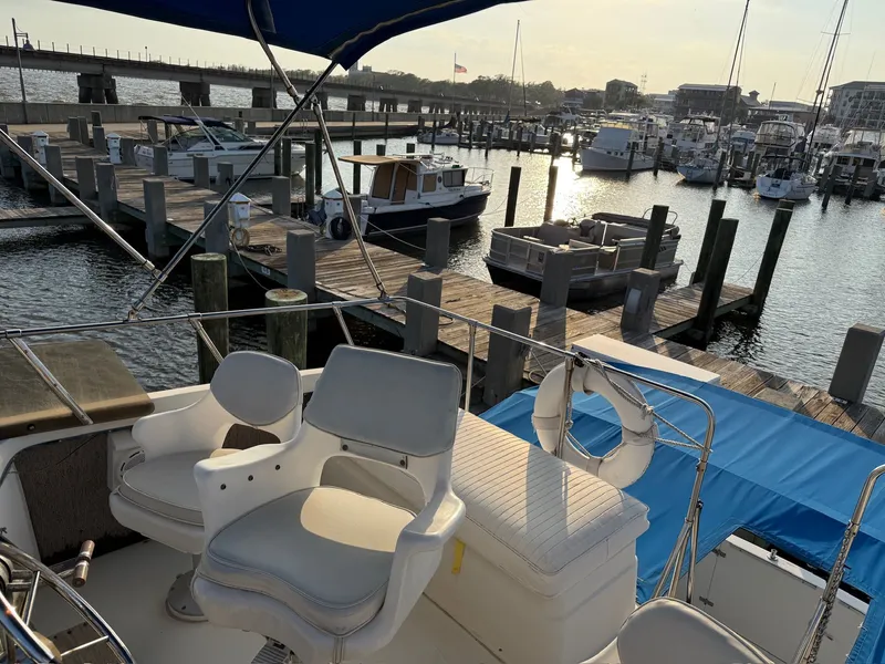 Slide: The Image of 1989 Carver 320 Voyager docked at marina during sunset. - 13