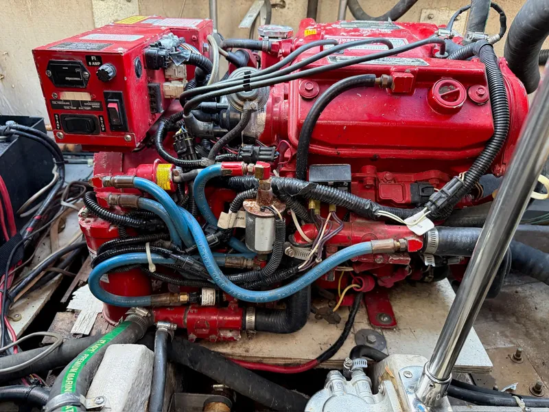 Slide: The Image of Engine compartment of 1989 Carver 320 Voyager with red components. - 16