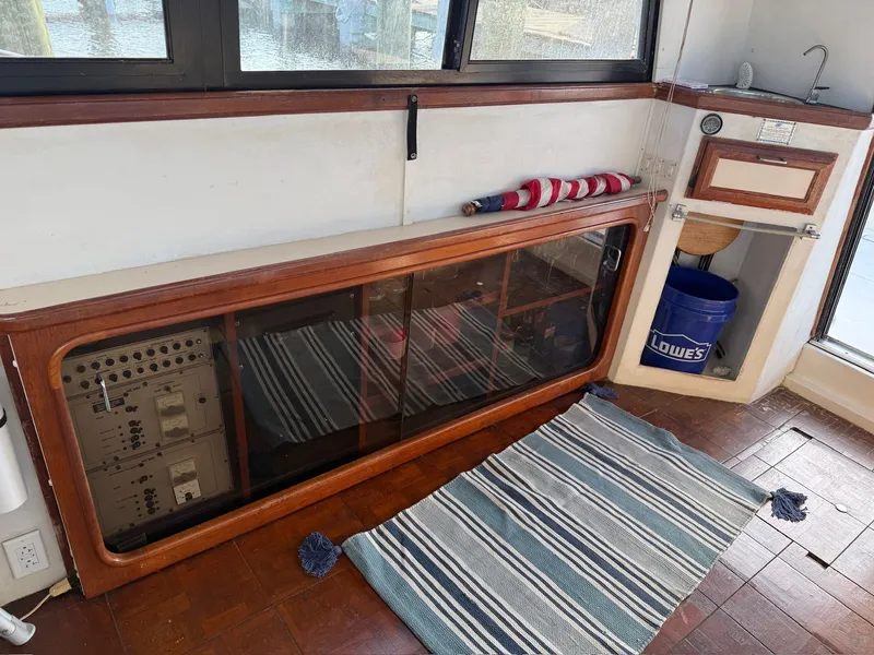 Slide: The Image of Interior of 1989 Carver 320 Voyager with rug and cabinet. - 21